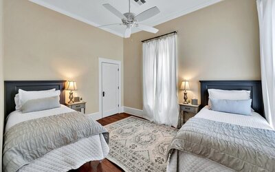 Bedroom with two twin beds  in this 3-bedroom, 2-bathroom vacation rental home near the Silos and Baylor in Waco, TX