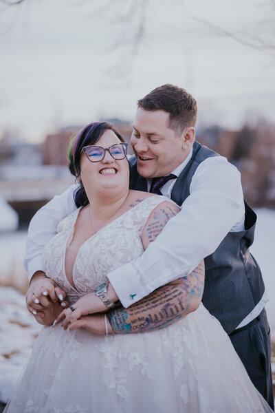 Minnesota Wedding Photographer captures bride holding groom's neck