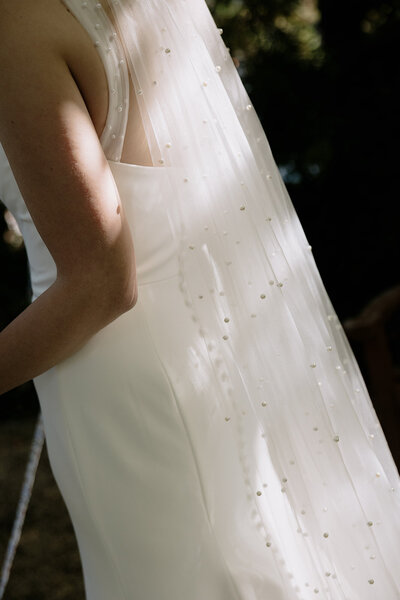 bride and groom posing during sunset