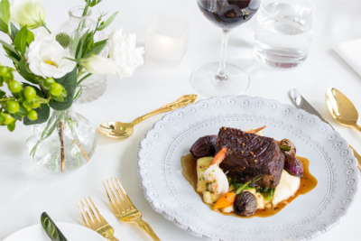 Upscale plated dinner of tenderloin, creamed potatoes, and roasted root vegetables by Oliver & Bonacini Catering from Alberta, on the Bronte Bride Vendor Guide.