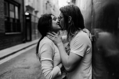 Woman and man kissing on the street