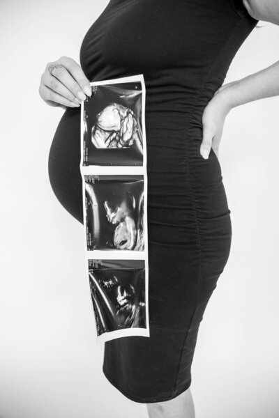 Photo of Expecting Mom holding ultrasound | Maternity Session