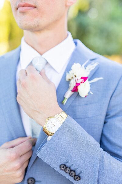 Groom in suit with boutonnière at The Old Polo Estate in Palm Springs | Sherr Weddings
