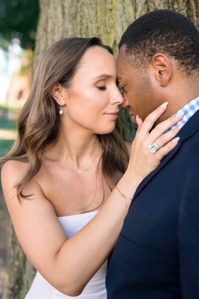 couple-caressing-under-tree