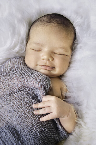 Newborn baby with swaddle