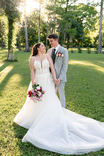 Couple poses after being married at Cypress Creek Farmhouse Orlando wedding venue