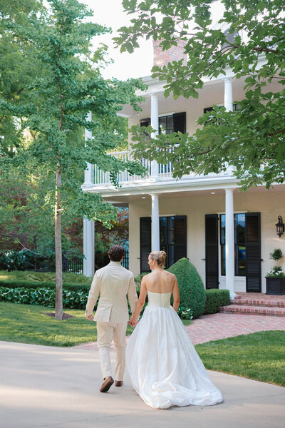bride and groom twirling on blue checker dance floor at Mission Hills Country Club Kansas City wedding