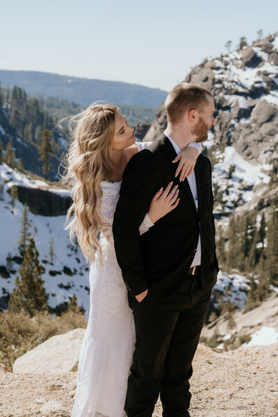 Bride and groom share an intimate moment after saying "i do" at snowy Sierra Nevada elopement