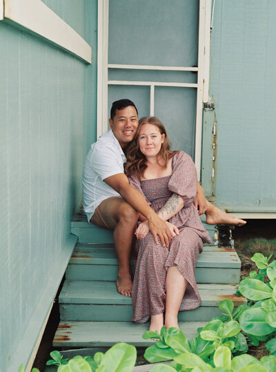 A New Orleans elopement photographer kisses her husband on the cheek.