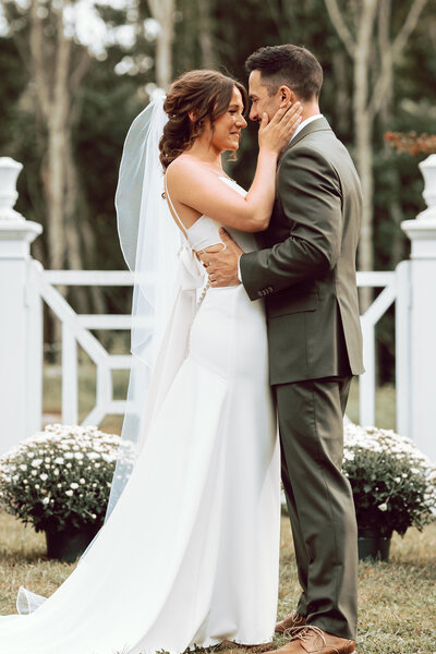 Photograph of a first kiss during a wedding.