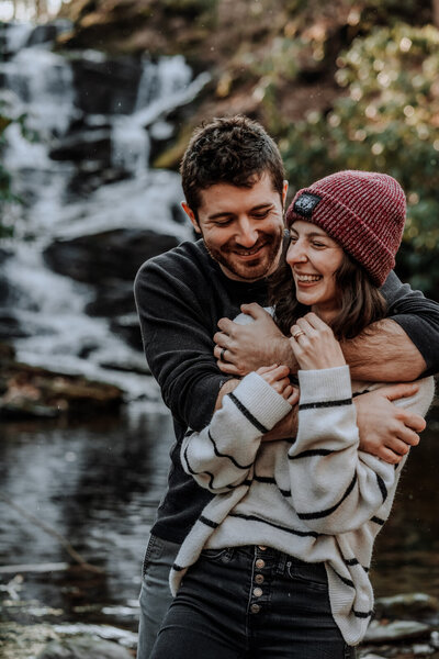 man kissing woman on cheek