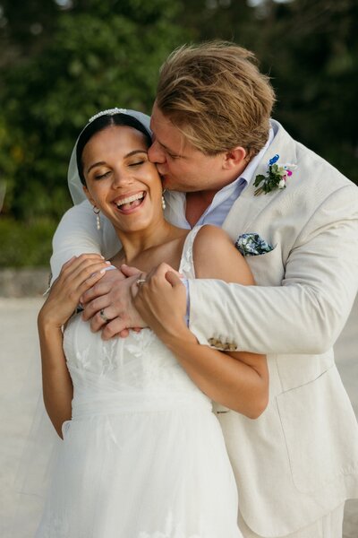 bride and groom hugging