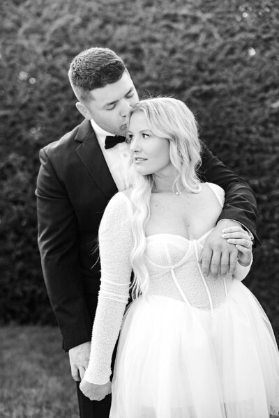 couple posing for wedding day at kingswood center garden captured by Ohio wedding photographer