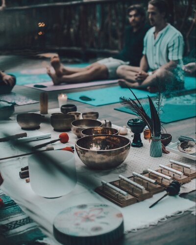 A sacred altar space at Kaaba Luum Retreats in Tulum, surrounded by lush jungle, featuring ceremonial offerings, candles, and ancestral elements used for spiritual healing and deep inner work.