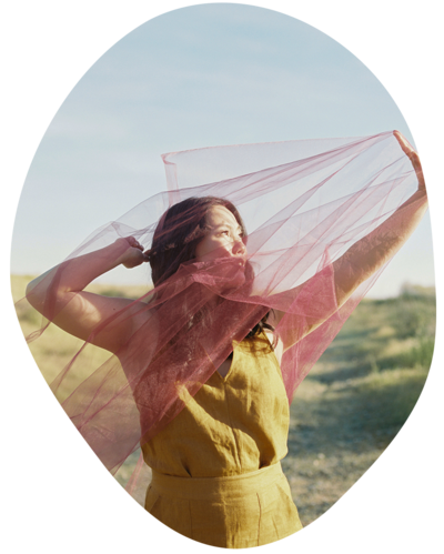 Joanne Lai standing in river thinking about somatic and holistic therapy