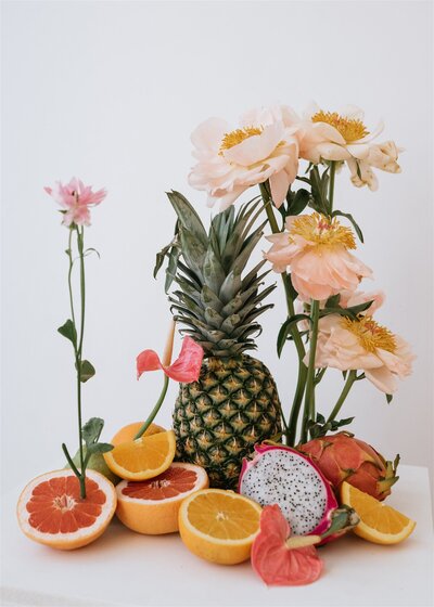 Arrangement of florals and citrus fruit
