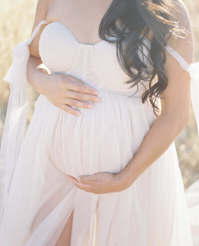mom holding her daughter at photography studio in San Francisco