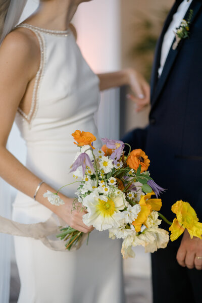 C&D at altar with the poppin bouquet.