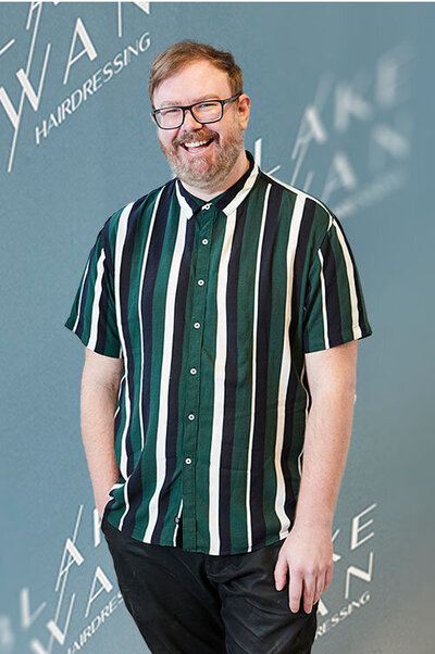 Hairstylist Tim at Blake & Kwan Sutherland Shire, highlighting personalised salon services in a modern setting.