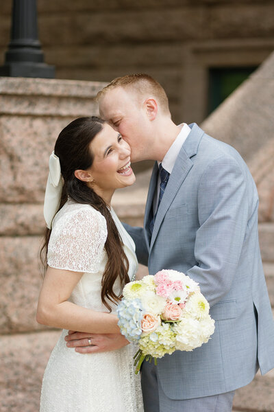 Fort Worth couple embracing after their courthouse wedding ceremony.