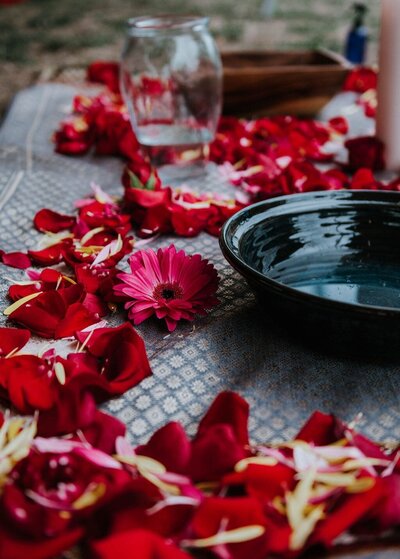 Florals laid out next to a ceramic bowl