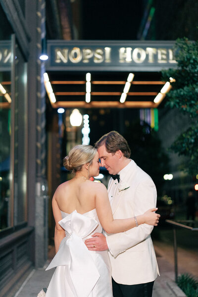 Mary Grace and Sam standing outside of the NOPSI hotel