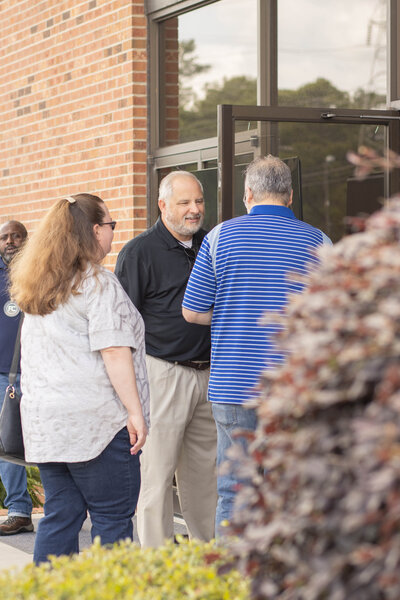 Host greeting a couple at a non-denominational church in Fayetteville, NC. 