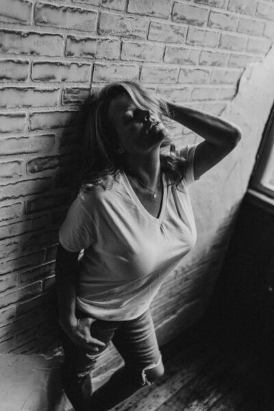woman leaning on the wall