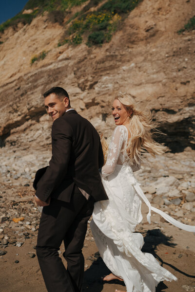 bride holding grooms cheek