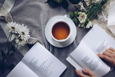 Cup of tea next to a book