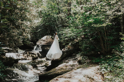 bride stands near creek