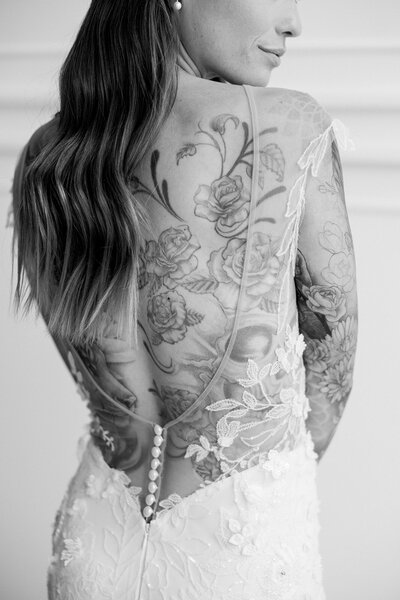 Calgary bride with tattoos on her back, beautiful in an open back dress