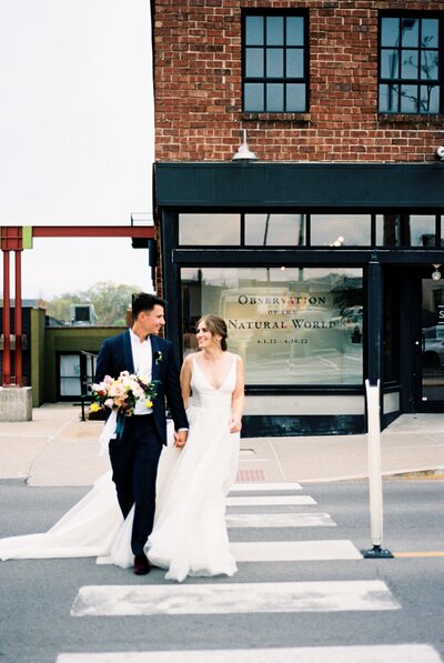 bride and groom walking down the street in Los Angeles, California