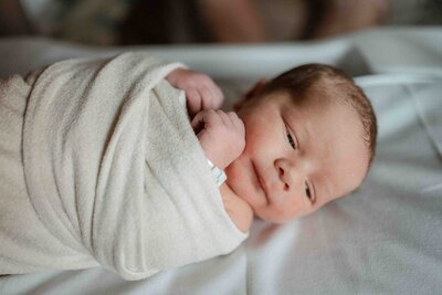 Pittsburgh Fresh 48 photographer captures baby swaddled in hospital bassinet during first day of life.