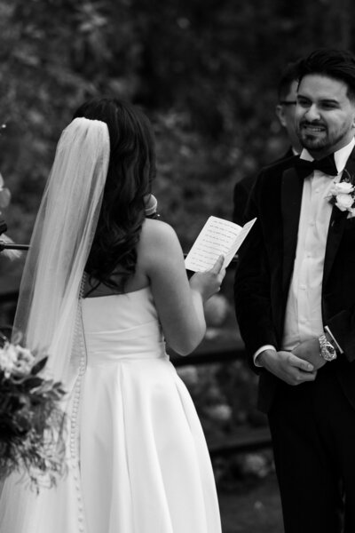 bride reading her vows to her groom