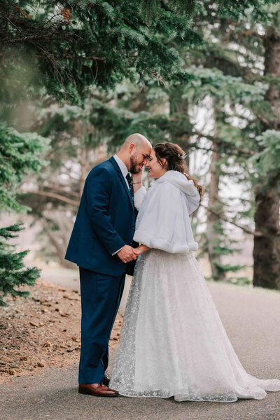 Bride holding husband's arm on a walking path at the U of S.