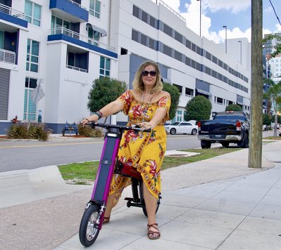 V&D Electric Bikes, Lady cruising around on her Purple Go-BIke M2