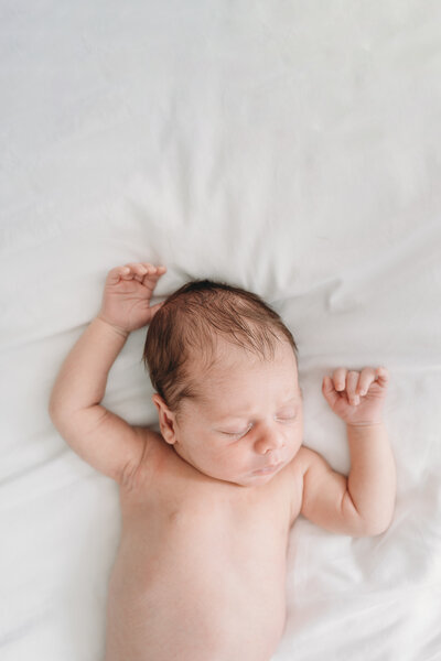 baby on white sheet photographed by NPS Photography