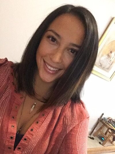 Woman smiling in red shirt