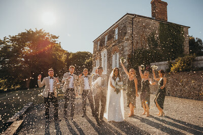 bride and bridesmaids walk together
