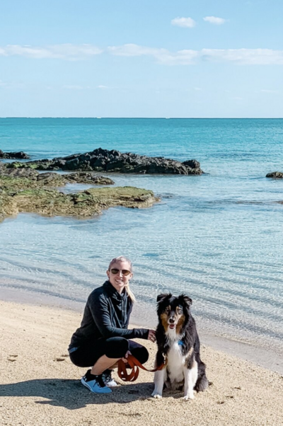 Heather and her dog Jackson enjoying the beach