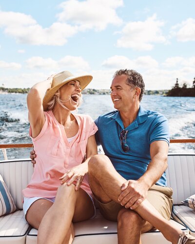 Couple laughing on a boat