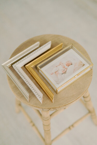 Newborn proof prints and frame corners for custom framing design by seattle newborn photographer, lena porter