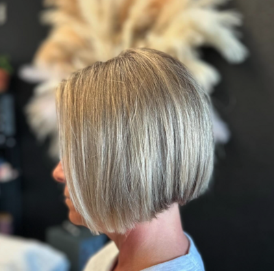 Short blonde bob haircut styled with clean lines at Lavender & Ink Studios