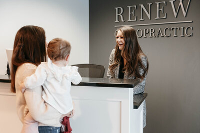 Professional setting showcasing a service provider engaging with a client in a well-lit office.