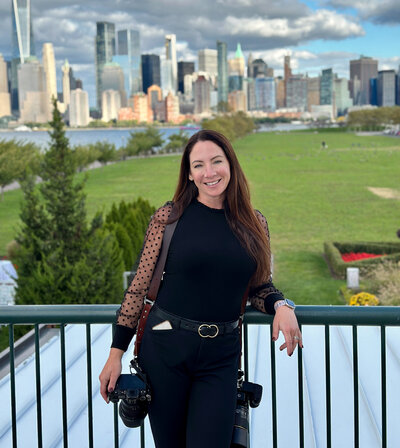 NJ wedding photographer Allison McCafferty standing outside of Liberty State Park in Jersey City NJ