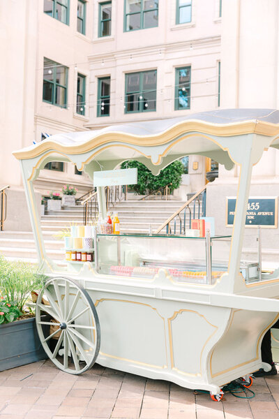Vintage wedding cart setup outdoors at venue