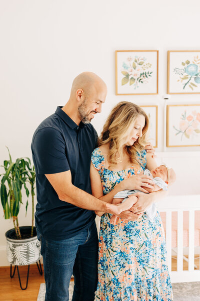 family with their newborn baby during a newborn photography session