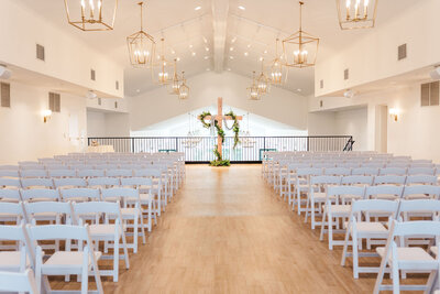 Indoor Ceremony space with cross arch