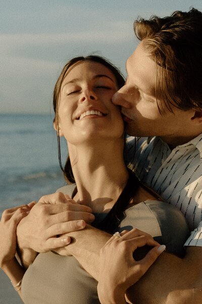 man kisses girlfriend